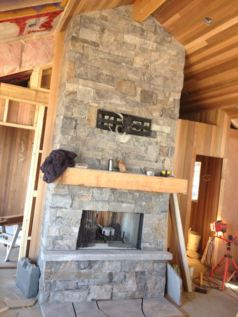 Log Cabins and Homes Structural insulated panel installation in custom timber frame home Ontario